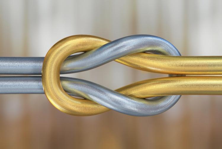 Gold and silver cords forming a reef knot