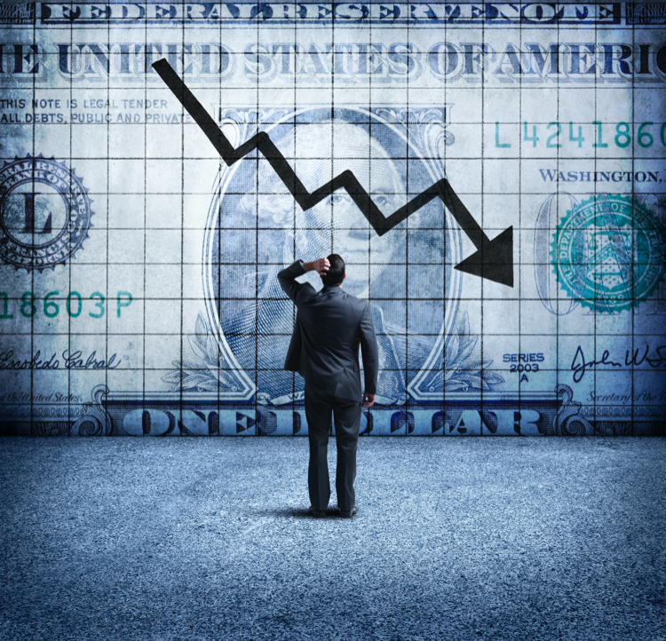 Businessman Looking Up At a Chart That Indicates A Falling U.S. Dollar