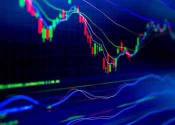 Selective focus of Business graph charts of financial instruments with various type of indicators combine with gold and account book and money. Concept investment. Moving average graph