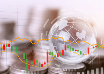 Coins stack and financial stock market graph.