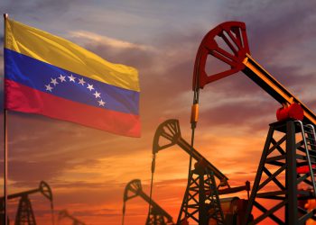 Venezuela oil industry concept. Industrial illustration - Venezuela flag and oil wells with the red and blue sunset or sunrise sky background - 3D illustration