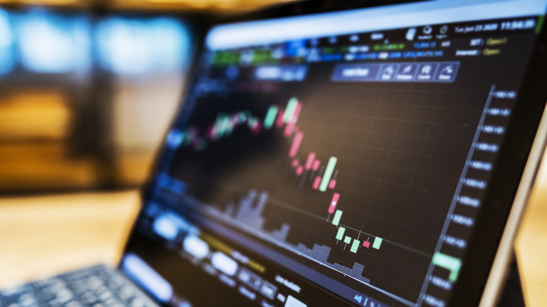 businessman using a laptop to check stock market data