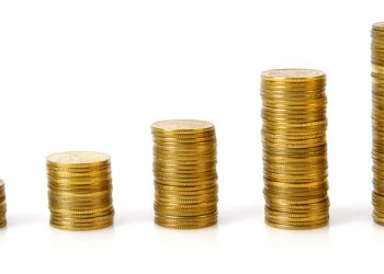 Business graph made of coins on a white background