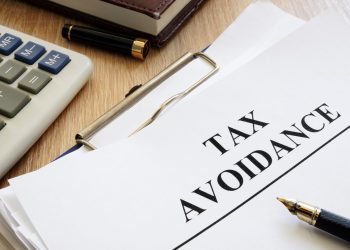 Documents about tax avoidance on a desk.