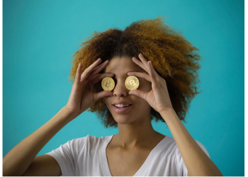 Woman Holding Two Coins