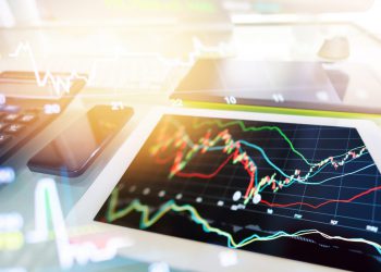 Investment theme stockmarket and finance business analysis stockmarket with digital tablet