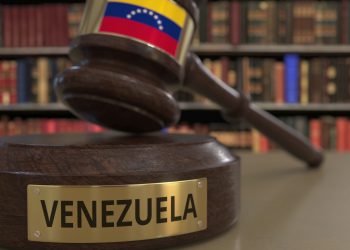 Flag on falling judge's gavel in court. National justice related conceptual 3D