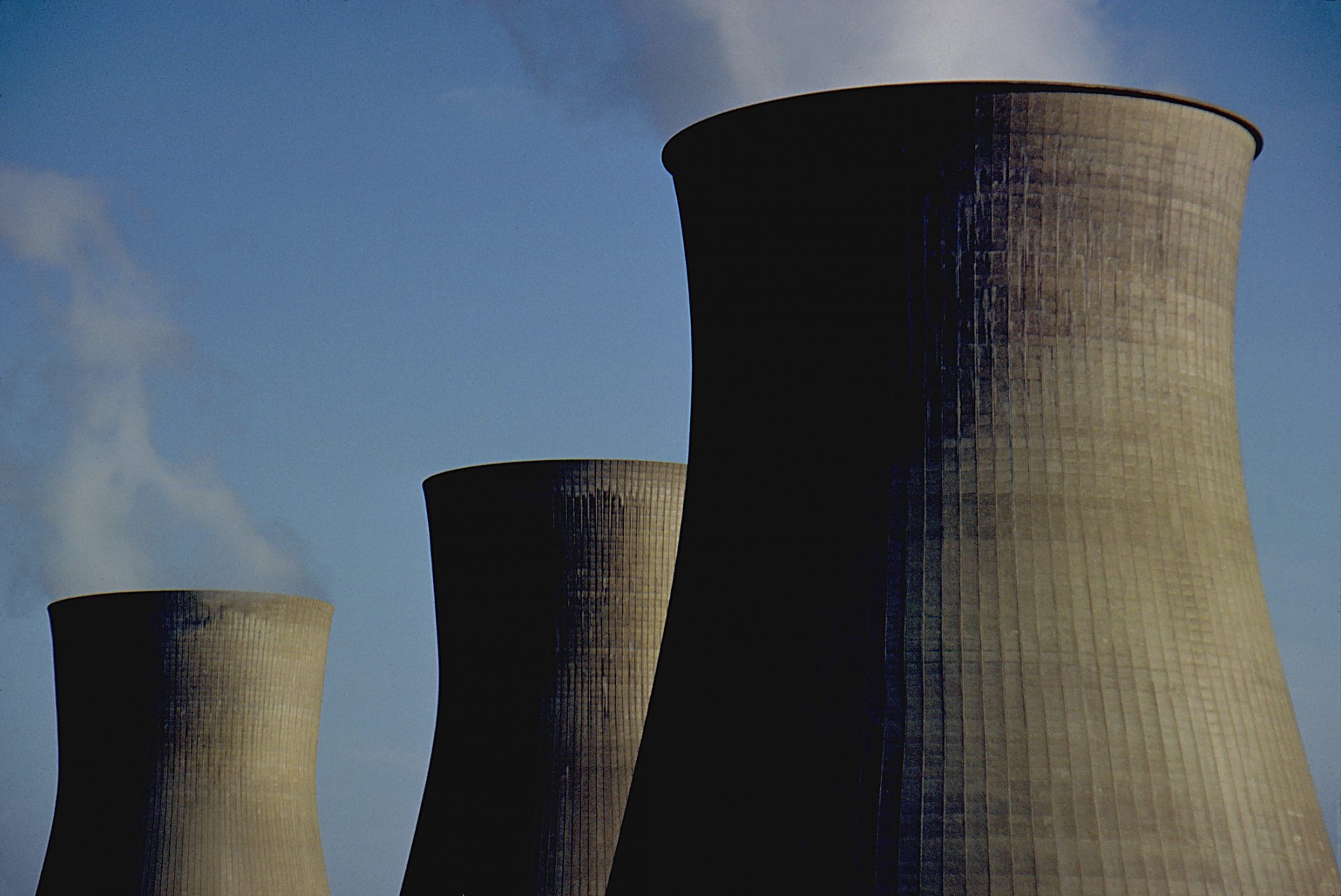 These are the iconic cooling towers of a nuclear power plant. these oversized smoke stacks vent steam form the Power plant