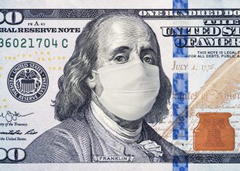 American President with a face mask against CoV infection. 100 dollar banknote. Coronavirus in United States. Concept quarantine and recession. Global economy hit by corona virus outbreak and pandemic
