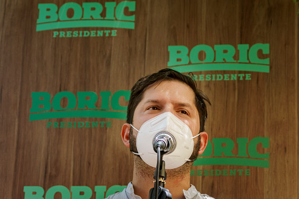 SANTIAGO, CHILE - NOVEMBER 26: Presidential candidate Gabriel Boric speaks during a press conference to present Izkia Siches (L), who resigned yesterday as President of the College of Physicians of Chile (COLMED) to join Boric's presidential campaign ahead of runoff on November 26, 2021 in Santiago, Chile. Boric will face Jose Antonio Kast in the Presidential runoff of December 19. (Photo by Sebastián Vivallo Oñate/Makro Agency/Getty Images)
