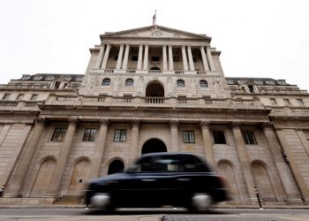 A black cab goes past the Bank of England in London on December 16, 2021. - The Bank of England hiked its key interest rate from 0.10 percent to 0.25 percent, as it seeks to combat decade-high inflation despite Omicron concerns. (Photo by Tolga Akmen / AFP) (Photo by TOLGA AKMEN/AFP via Getty Images)