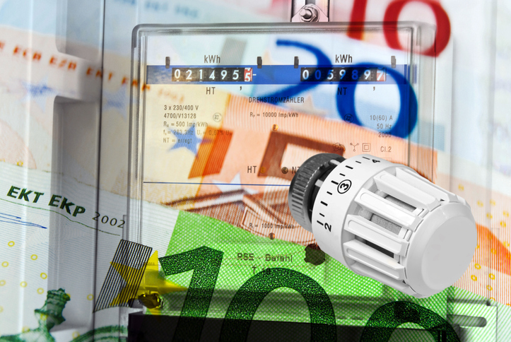 Electricity meter and heating valve energy costs with euro banknotes concept abstract