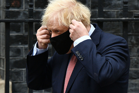 LONDON, ENGLAND - OCTOBER 06: British Prime Minister Boris Johnson leaves Downing Street ahead of delivering his Leader's Speech to the Conservative Party Conference on October 6, 2020 in London, England. Due to Covid-19 restrictions the political party conferences are being held virtually this year. In his leader's speech Johnson will look to the future and pledge the UK to become the "Saudi Arabia of Wind Power" promising to become a world leader in green energy with every home in Britain powered by offshore wind farms within a decade. (Photo by Leon Neal/Getty Images)