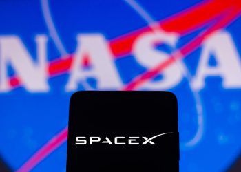 In this photo illustration a SpaceX is displayed on a