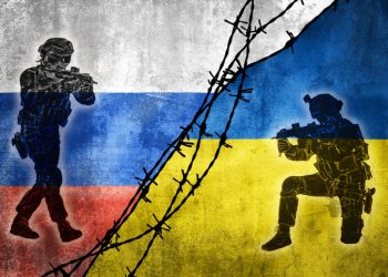 Grunge flags of Russian Federation and Ukraine divided by barb wire with soliders pointing weapon at each other illustration, concept of tense relations between west and Russia