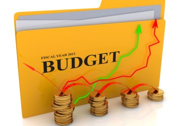 Folder with budget documents and graph coins