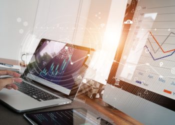 Business report and sales data with graph economic growth on computer screen network, chart financial, digital marketing, online banking and payment at office background.