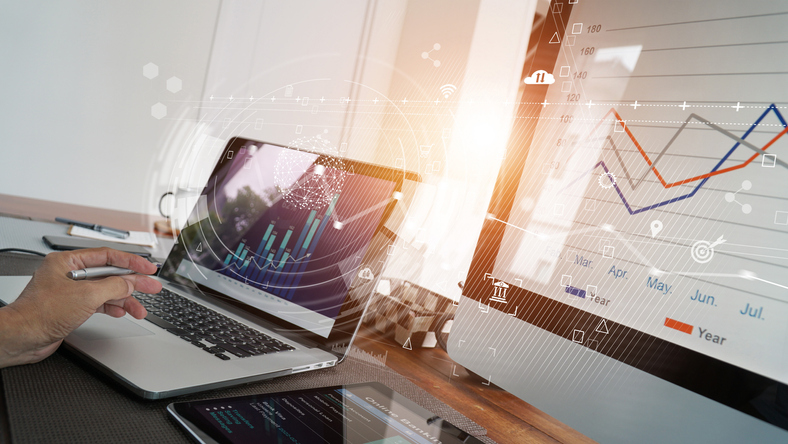 Business report and sales data with graph economic growth on computer screen network, chart financial, digital marketing, online banking and payment at office background.
