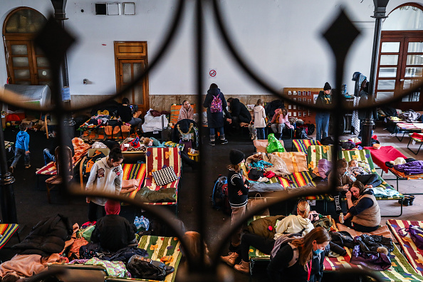 Refugees from Ukraine who arrived to Krakow due to ongoing Russian military invasion are seen at a temporary shelter inside the reception point organized in a former historic building of railway station in Krakow, Poland on March 7, 2022. Russian invasion on Ukraine causes a mass exodus of refugees to Poland. (Photo by Beata Zawrzel/NurPhoto via Getty Images)