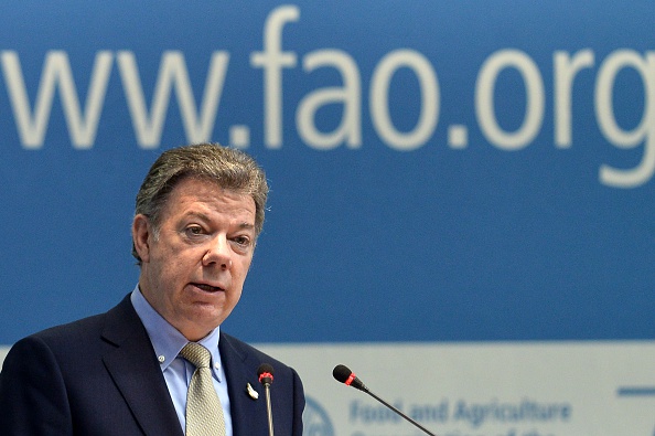 The President of Colombia, Juan Manuel Santos Calderon, delivers a speech during the 39th Session of the FAO Conference on June 13, 2015 at the Food and Agriculture Organisation (FAO) headquarters in Rome. AFP PHOTO / TIZIANA FABI (Photo credit should read TIZIANA FABI/AFP via Getty Images)