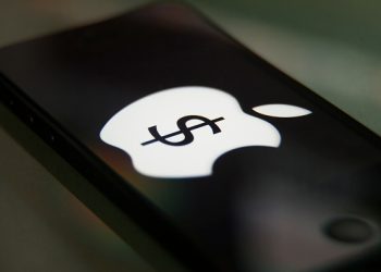 Apple Pay logo on a iPhone. Apple Pay is the new digital wallet from Apple. Credit card payments will be made with the iPhone instead of a card. (Photo by Ted Soqui/Corbis via Getty Images)
