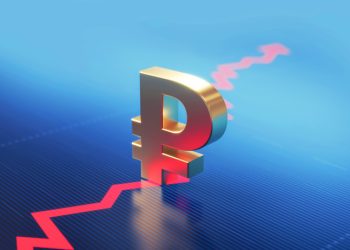 Russian Ruble symbol standing over a financial graph. Selective focus. Horizontal composition with copy space.
