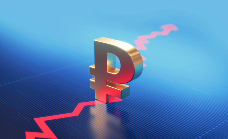 Russian Ruble symbol standing over a financial graph. Selective focus. Horizontal composition with copy space.