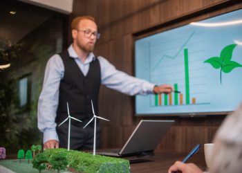 Businessmen talking about renewable energy - wind energy