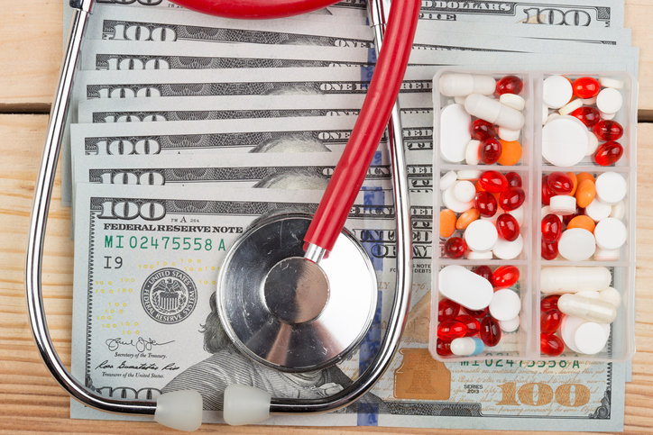 Doctors medical stethoscope on money background - healthcare expensive concept